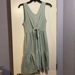 Teal dress with tie. Tank with length just above the knee.
